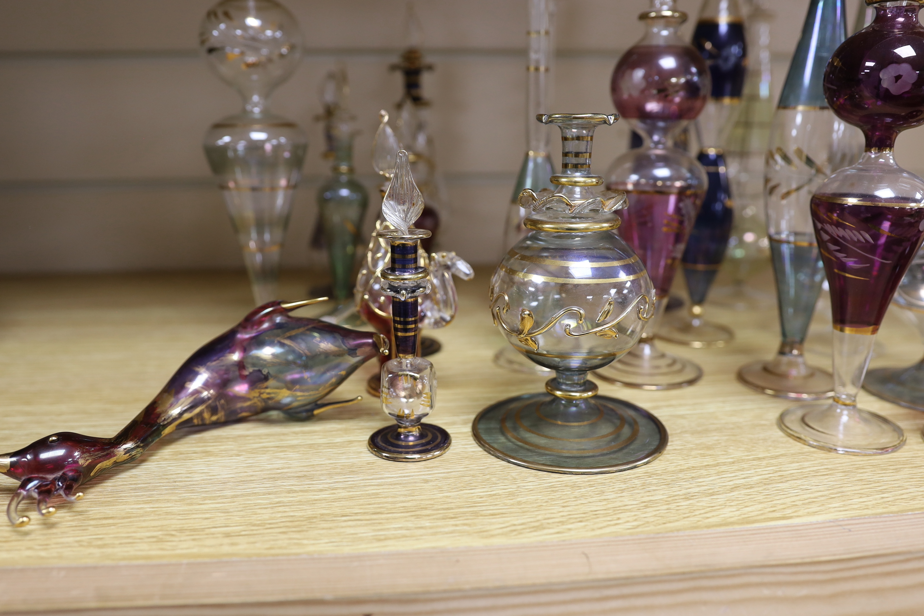 A collection of gilded glass scent bottles and stoppers, 27cm